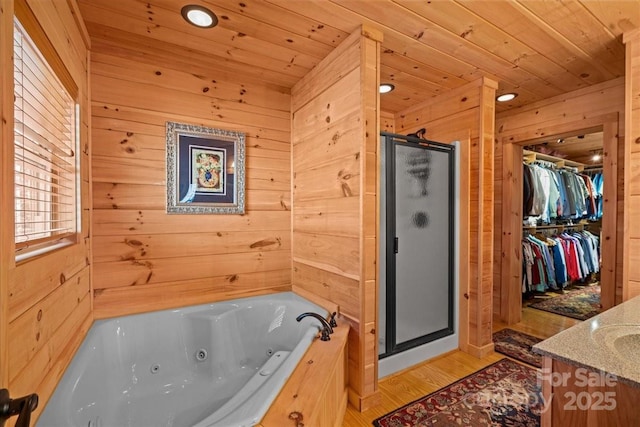650 Mcdowell Rd, Columbus, NC 28722 - full bath with wooden ceiling, a shower stall, wood walls, a tub with jets, and vanity