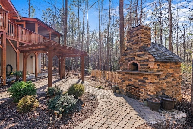 650 Mcdowell Rd, Columbus, NC 28722 - view of patio / terrace featuring a sunroom, an outdoor stone fireplace, and a deck