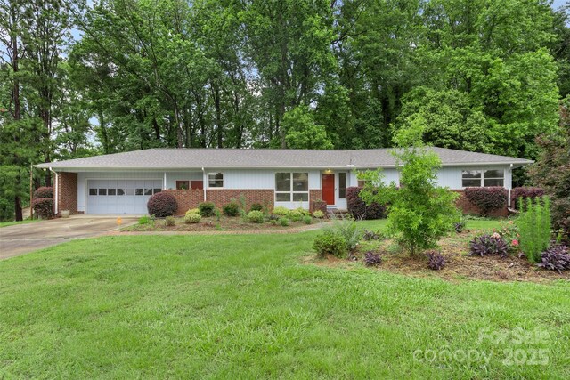 2666 Providence Dr, Gastonia, NC 28052 - ranch-style house featuring a garage, brick siding, concrete driveway, and a front yard