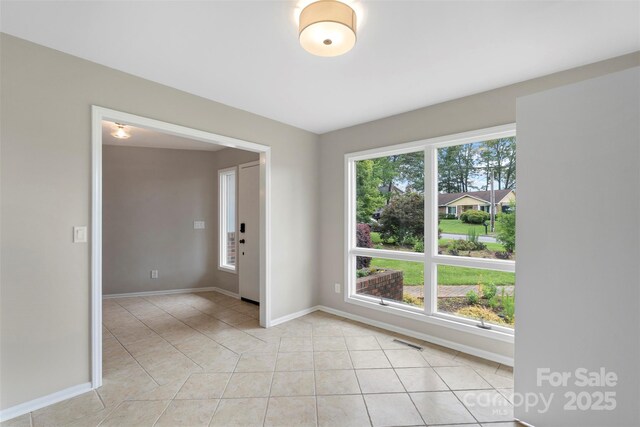2666 Providence Dr, Gastonia, NC 28052 - unfurnished room featuring baseboards and light tile patterned floors