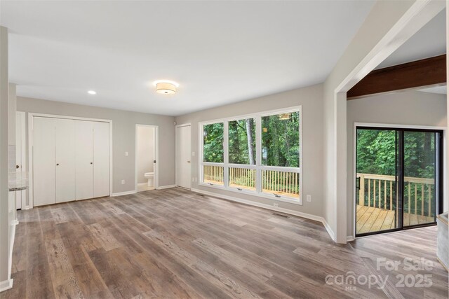 2666 Providence Dr, Gastonia, NC 28052 - unfurnished bedroom with baseboards, access to outside, wood finished floors, and recessed lighting