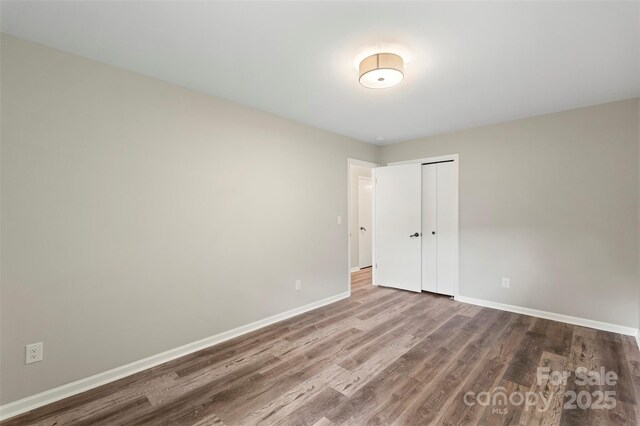 2666 Providence Dr, Gastonia, NC 28052 - unfurnished room with baseboards and wood finished floors