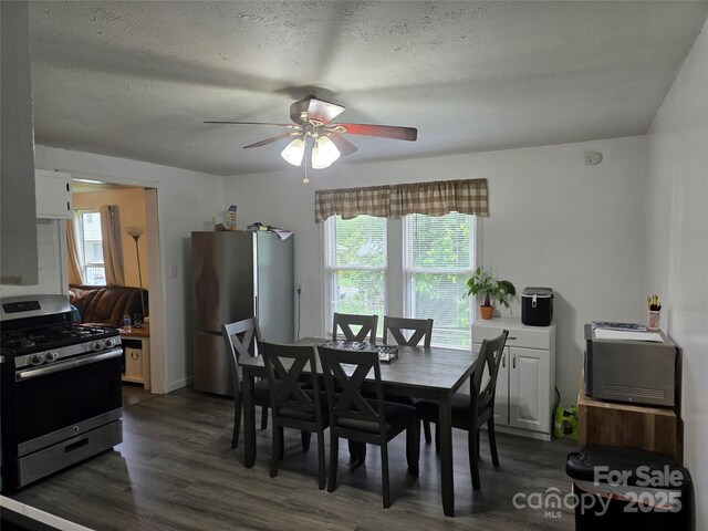 23 Pearl St, Granite Falls, NC 28630 - dining area featuring dark wood finished floors, ceiling fan, healthy amount of natural light, and a textured ceiling