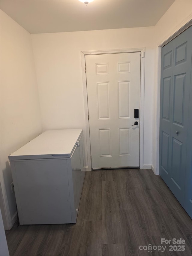 23 Pearl St, Granite Falls, NC 28630 - laundry area with dark wood-type flooring and baseboards