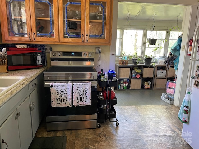 280 Walnut Ave, Spruce Pine, NC 28777 - kitchen featuring electric range, glass insert cabinets, and light countertops