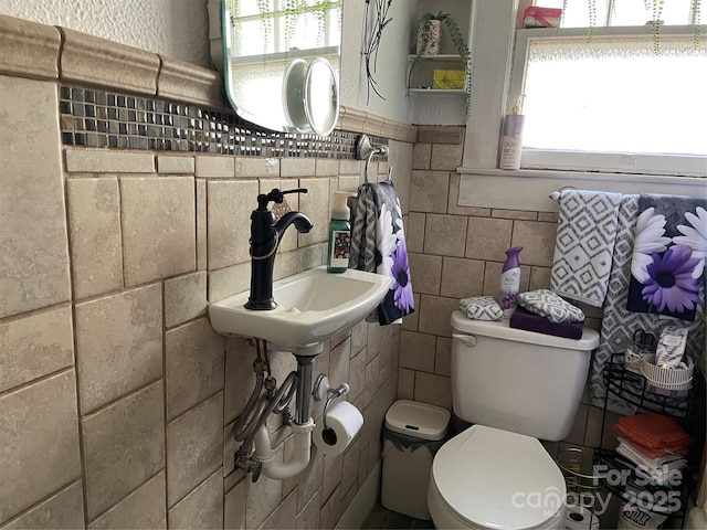280 Walnut Ave, Spruce Pine, NC 28777 - bathroom with tile walls, plenty of natural light, toilet, and wainscoting