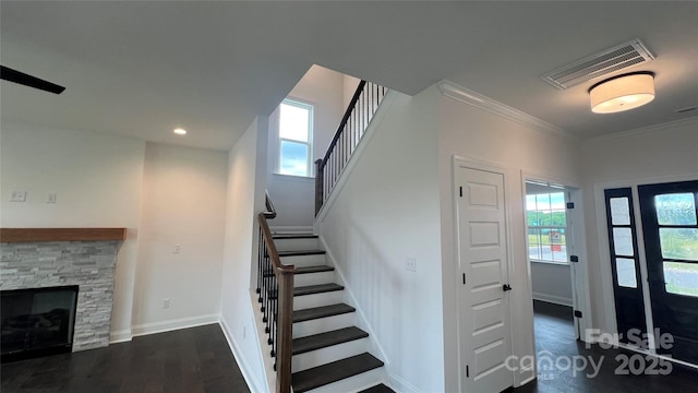 102 Cartington Way Unit Haf0042, Mooresville, NC 28115 - stairway with wood finished floors, ornamental molding, a stone fireplace, and recessed lighting