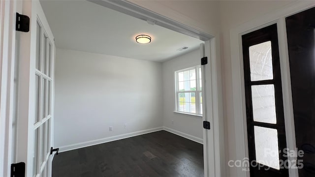 102 Cartington Way Unit Haf0042, Mooresville, NC 28115 - spare room featuring dark wood-type flooring and baseboards