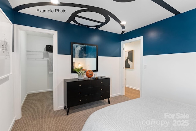 102 Cartington Way Unit Haf0042, Mooresville, NC 28115 - carpeted bedroom featuring a walk in closet and a closet