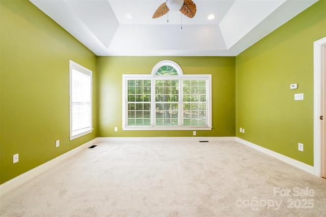 3917 Erskine Woods Dr, Bessemer City, NC 28016 - carpeted spare room featuring a tray ceiling, a ceiling fan, plenty of natural light, and recessed lighting