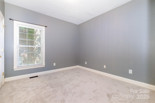 3917 Erskine Woods Dr, Bessemer City, NC 28016 - spare room with carpet, baseboards, and vaulted ceiling