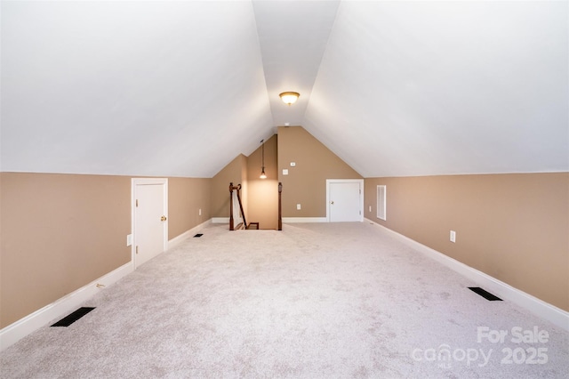 3917 Erskine Woods Dr, Bessemer City, NC 28016 - additional living space with lofted ceiling, carpet floors, and baseboards