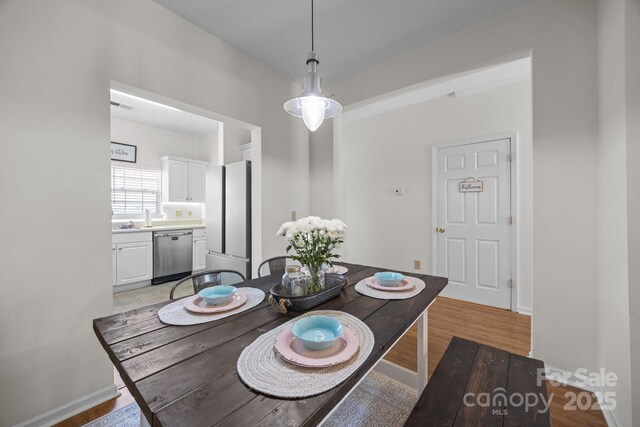 740 Tavern Ct Unit 7, Rock Hill, SC 29732 - dining space featuring light wood-type flooring and baseboards
