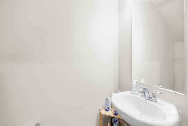 5204 Belstone Ln, Charlotte, NC 28215 - bathroom featuring a sink and lofted ceiling