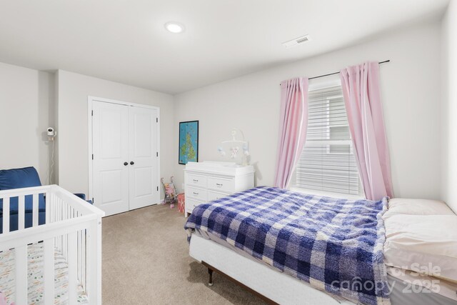 5204 Belstone Ln, Charlotte, NC 28215 - bedroom with light carpet, a closet, and recessed lighting
