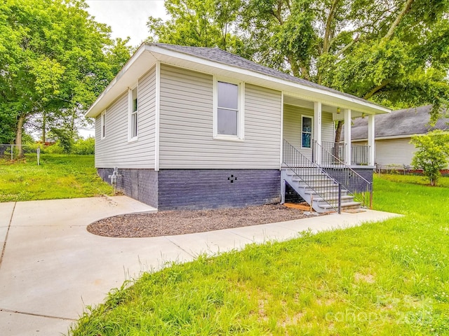 2440 Myers St, Gastonia, NC 28056 - view of front of house featuring a porch, a front lawn, and stairs