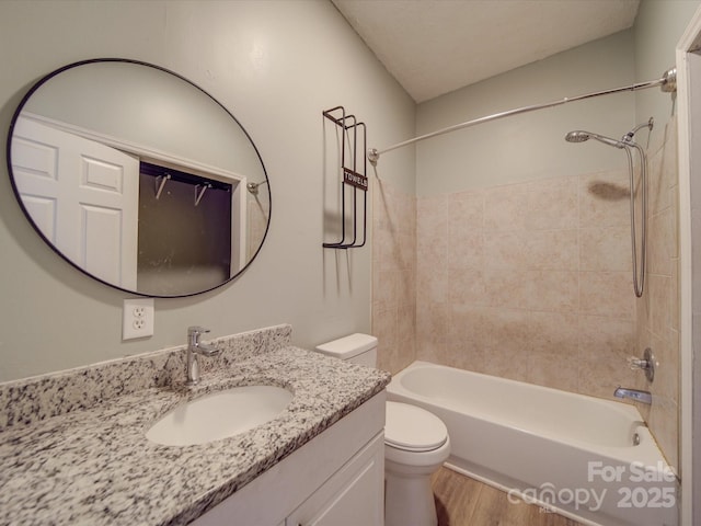 2440 Myers St, Gastonia, NC 28056 - bathroom featuring toilet, vanity, bathtub / shower combination, and wood finished floors