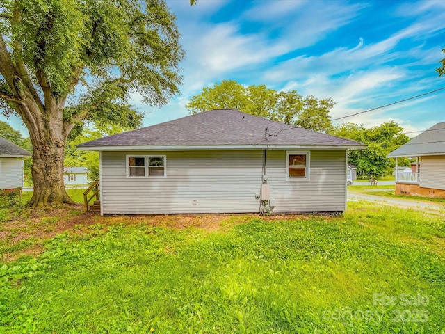 2440 Myers St, Gastonia, NC 28056 - back of property with a yard and a shingled roof