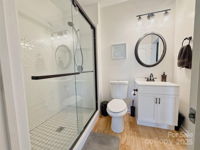 3416 Yarmouth Ln, Gastonia, NC 28056 - full bath featuring wood finished floors, toilet, a stall shower, and vanity
