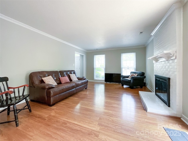 2619 Quailrush Rd, Charlotte, NC 28226 - living area with light wood-style floors, a fireplace, crown molding, and baseboards