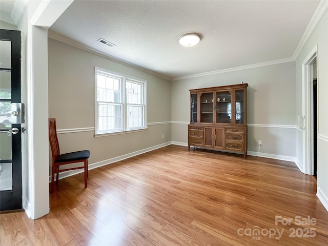 2619 Quailrush Rd, Charlotte, NC 28226 - unfurnished dining area featuring light wood finished floors, crown molding, and baseboards
