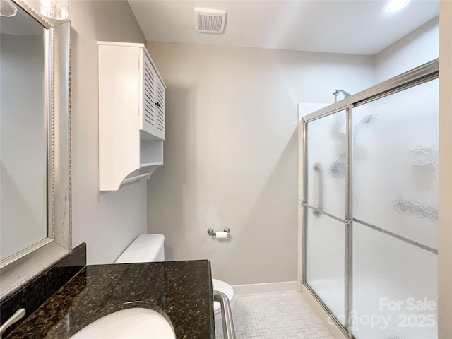 2619 Quailrush Rd, Charlotte, NC 28226 - full bathroom featuring toilet, vanity, a stall shower, tile patterned flooring, and recessed lighting