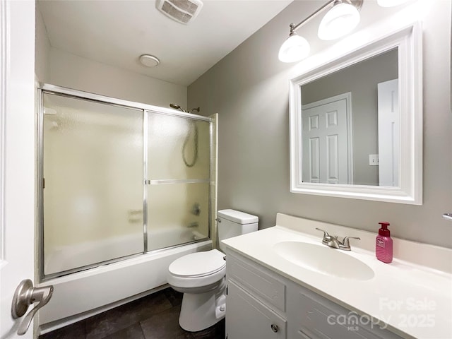 2619 Quailrush Rd, Charlotte, NC 28226 - full bathroom featuring vanity, toilet, combined bath / shower with glass door, and tile patterned flooring