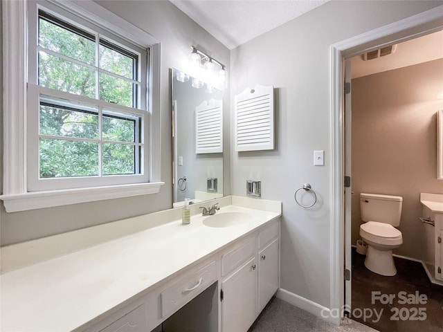2619 Quailrush Rd, Charlotte, NC 28226 - bathroom with vanity, toilet, and baseboards
