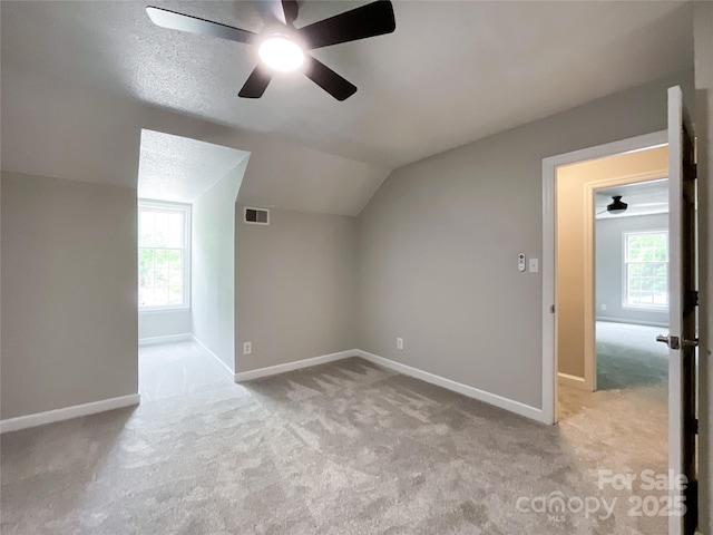2619 Quailrush Rd, Charlotte, NC 28226 - bonus room featuring ceiling fan, carpet flooring, vaulted ceiling, baseboards, and healthy amount of natural light