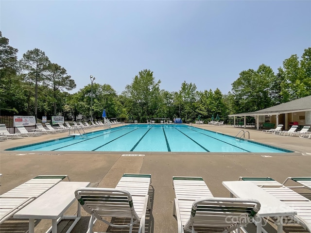 2619 Quailrush Rd, Charlotte, NC 28226 - community pool with a patio and view of wooded area
