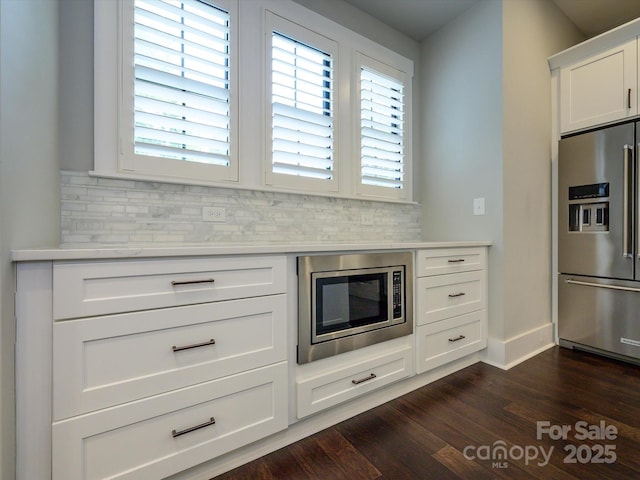 9426 Greyson Ridge Dr, Charlotte, NC 28277 - kitchen featuring appliances with stainless steel finishes, light countertops, and decorative backsplash
