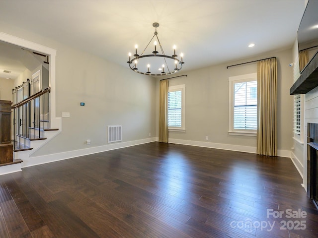 9426 Greyson Ridge Dr, Charlotte, NC 28277 - unfurnished living room featuring a chandelier, wood finished floors, baseboards, a fireplace, and recessed lighting