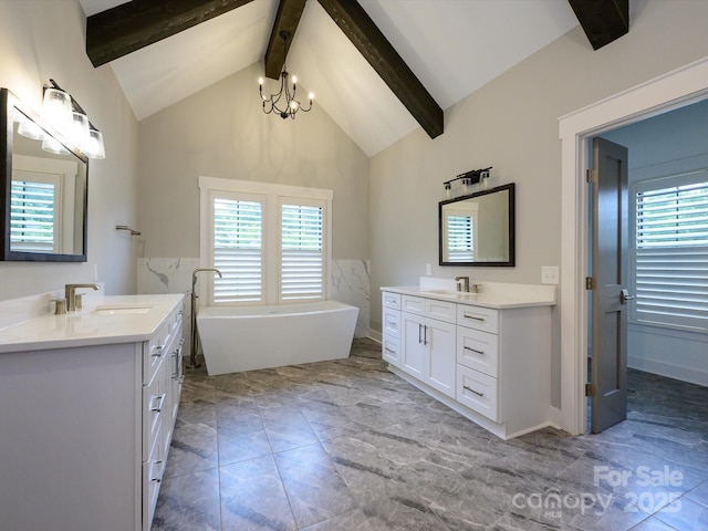 9426 Greyson Ridge Dr, Charlotte, NC 28277 - bathroom with two vanities, a freestanding tub, a chandelier, beamed ceiling, and high vaulted ceiling