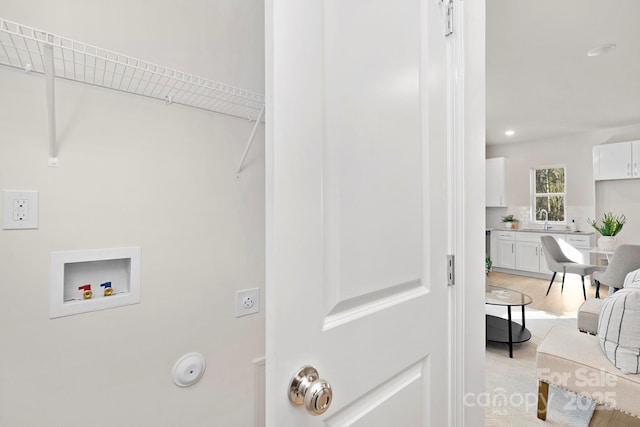 409 Blanton St, Shelby, NC 28150 - washroom with washer hookup, light wood-style floors, and recessed lighting