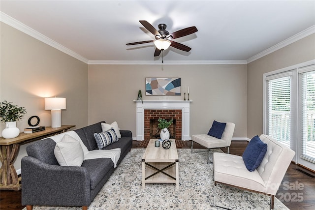 4637 Shannamara Dr, Matthews, NC 28104 - living area with crown molding, wood finished floors, a ceiling fan, a brick fireplace, and baseboards