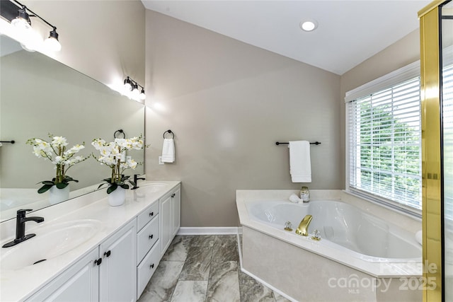 4637 Shannamara Dr, Matthews, NC 28104 - full bathroom featuring double vanity, a bath, marble look tile flooring, vaulted ceiling, and recessed lighting