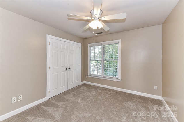 4637 Shannamara Dr, Matthews, NC 28104 - unfurnished bedroom with carpet floors, baseboards, a closet, and ceiling fan