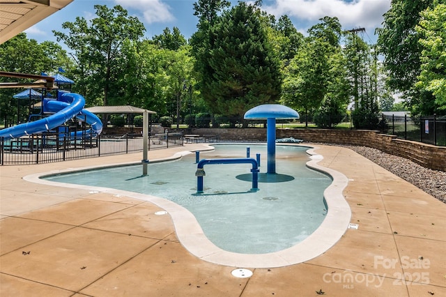 4637 Shannamara Dr, Matthews, NC 28104 - community pool with a water play area, view of scattered trees, a gazebo, and a patio area