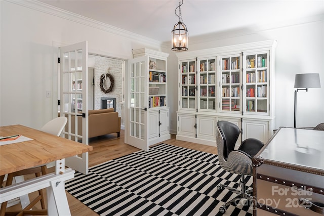 55 Foster Estate Dr, Asheville, NC 28806 - office with light wood finished floors, ornamental molding, a chandelier, and a fireplace