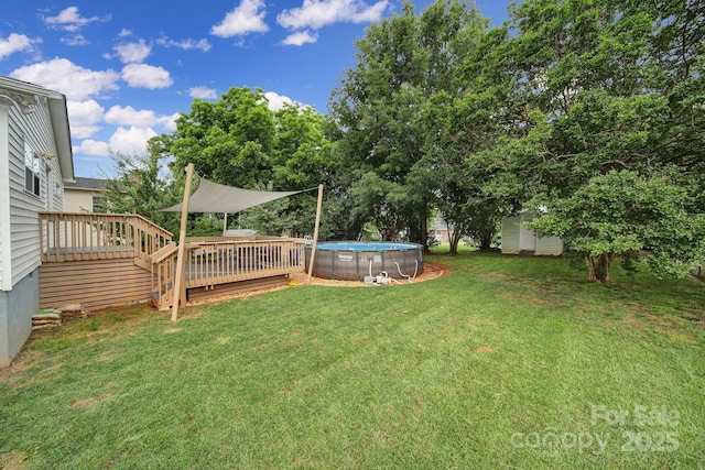 842 Cherry Rd S, Rock Hill, SC 29732 - view of green lawn with a deck, an outdoor pool, and a storage shed