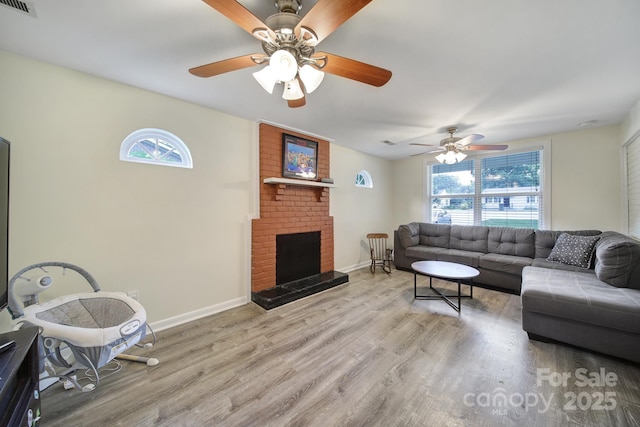 842 Cherry Rd S, Rock Hill, SC 29732 - living area with plenty of natural light, wood finished floors, ceiling fan, and a fireplace