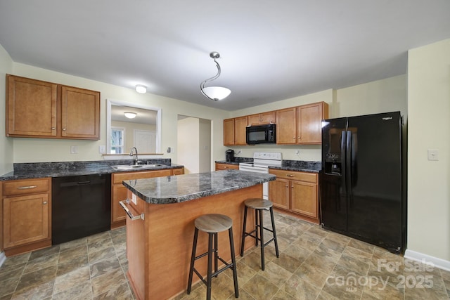 842 Cherry Rd S, Rock Hill, SC 29732 - kitchen with black appliances, stone finish floors, a kitchen island, and dark countertops