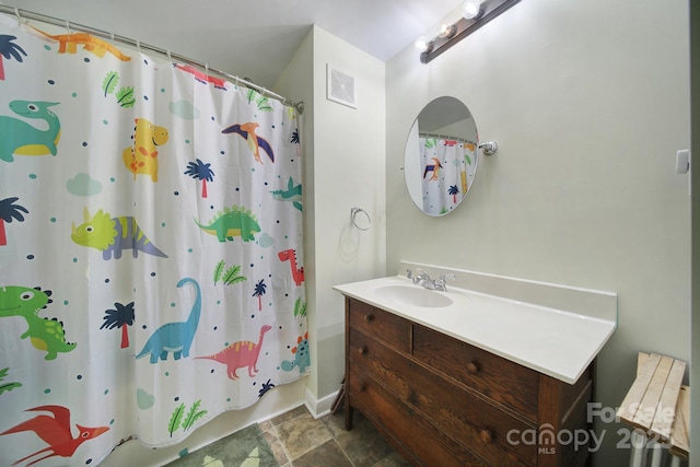 842 Cherry Rd S, Rock Hill, SC 29732 - bathroom featuring vanity, shower / bath combo with shower curtain, and stone finish floors