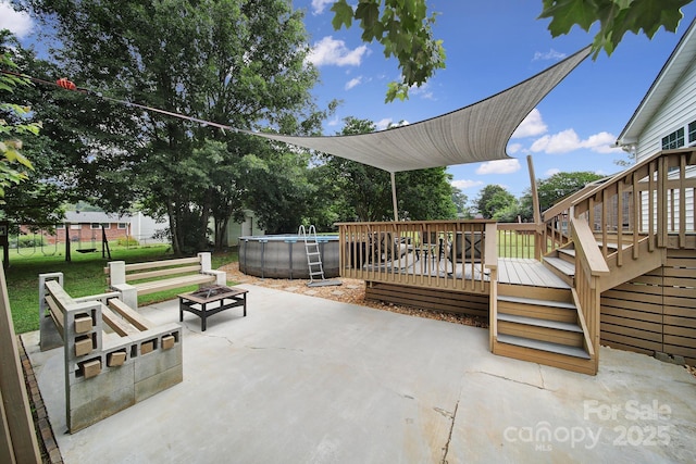 842 Cherry Rd S, Rock Hill, SC 29732 - view of patio with a wooden deck, an outdoor pool, an outdoor fire pit, and stairs