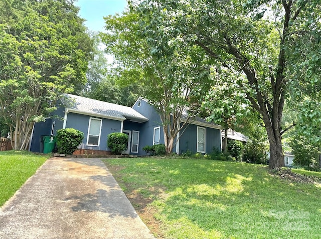 11421 Kingfisher Dr, Charlotte, NC 28226 - ranch-style house featuring concrete driveway, a front yard, and a shingled roof