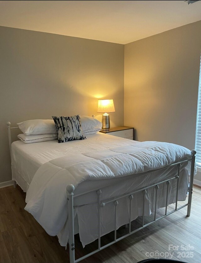 11421 Kingfisher Dr, Charlotte, NC 28226 - bedroom featuring wood finished floors and baseboards
