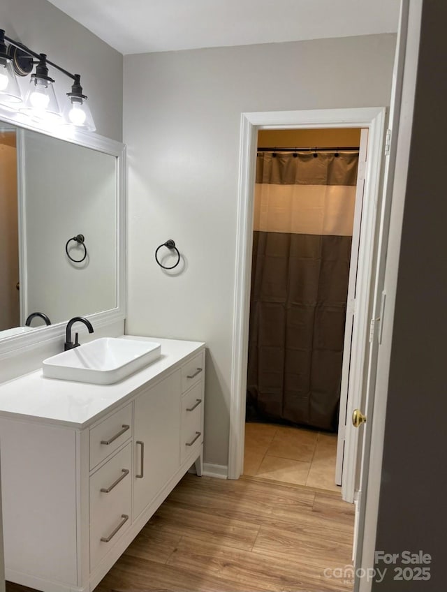 11421 Kingfisher Dr, Charlotte, NC 28226 - full bathroom featuring vanity and wood finished floors