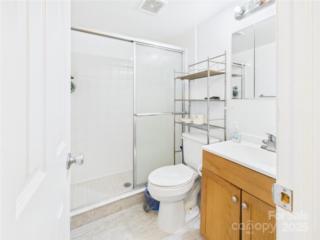3055 16th St NE, Hickory, NC 28601 - full bathroom featuring a stall shower, vanity, toilet, and tile patterned flooring