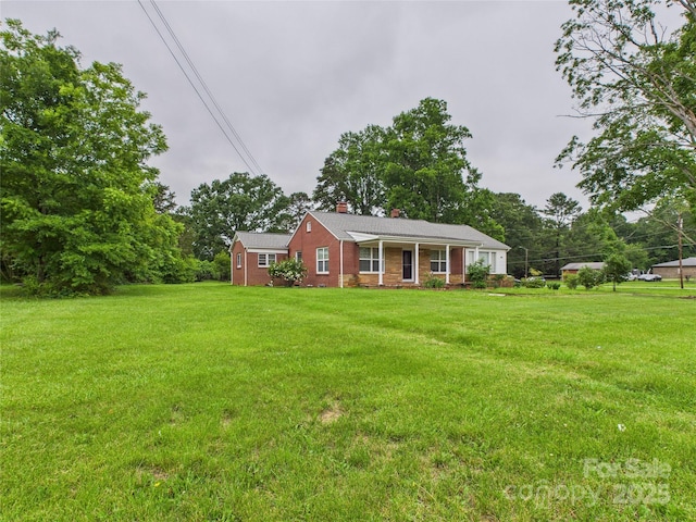 3055 16th St NE, Hickory, NC 28601 - ranch-style house featuring a chimney, a front yard, and brick siding