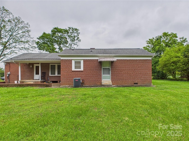 3055 16th St NE, Hickory, NC 28601 - back of property with a yard, brick siding, central AC unit, and crawl space